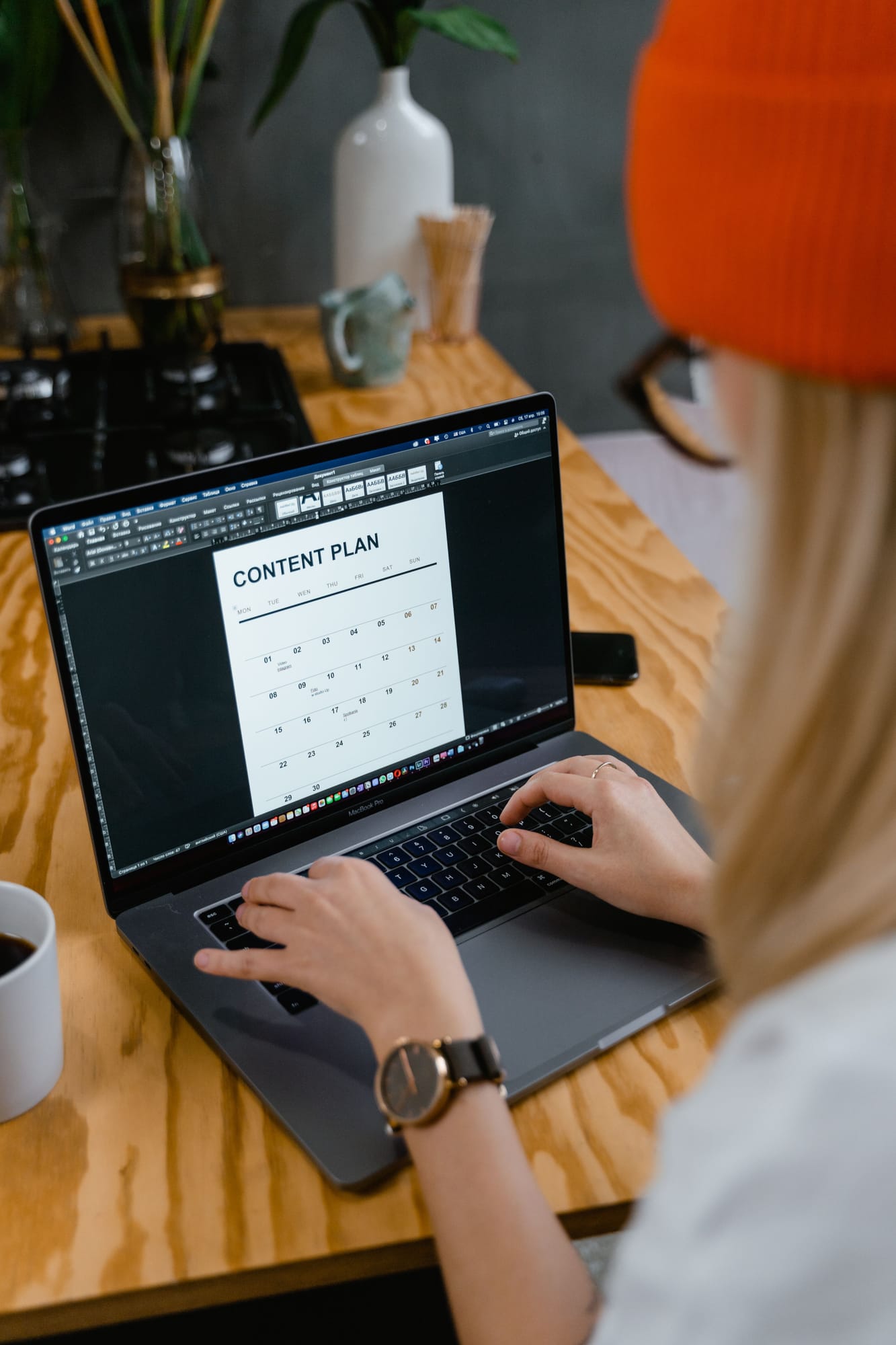 Person working on a content plan at a laptop